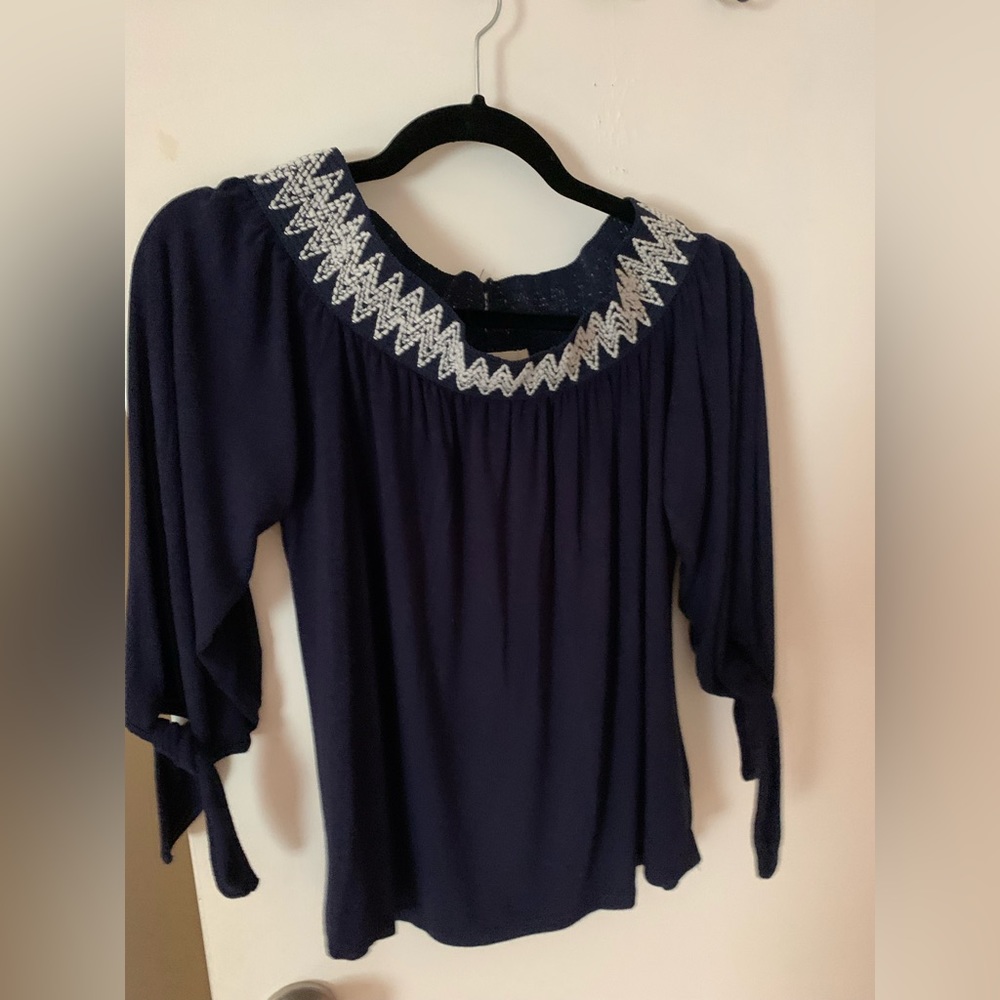 Navy top with white ranches detailing.  Size medium
